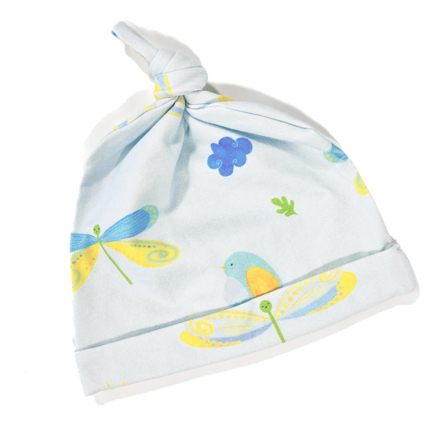 A pale blue organic cotton knotted beanie  hat with dragonfly and bird patterns on it, for babies or toddlers.