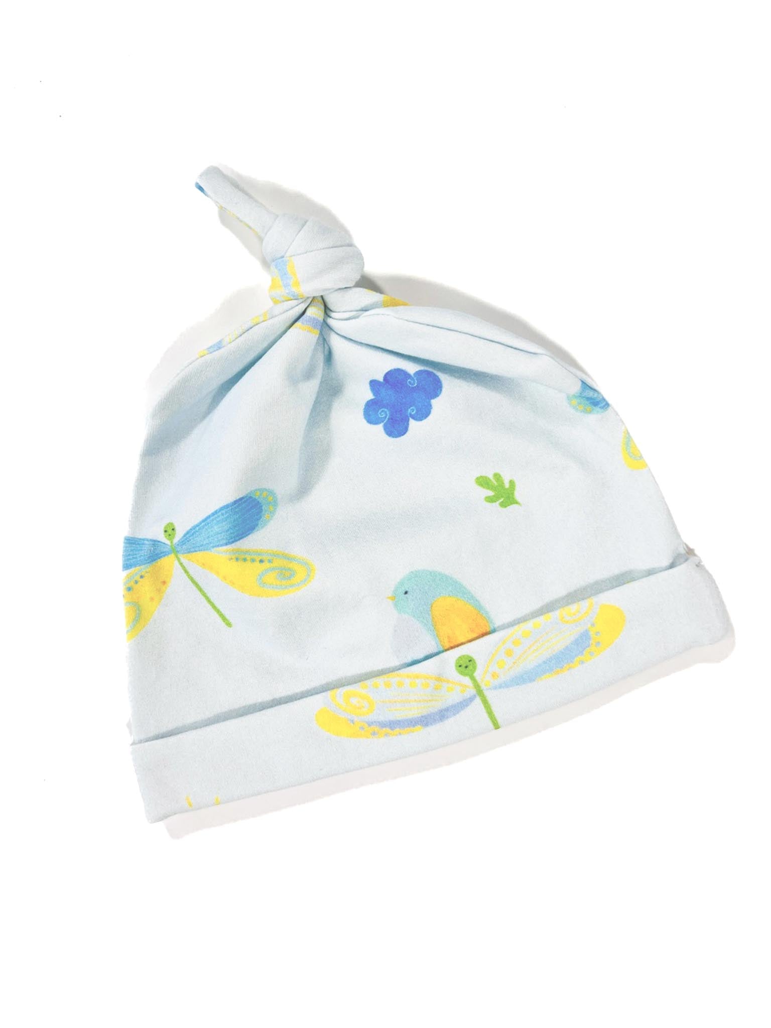 A pale blue organic cotton knotted beanie  hat with dragonfly and bird patterns on it, for babies or toddlers.