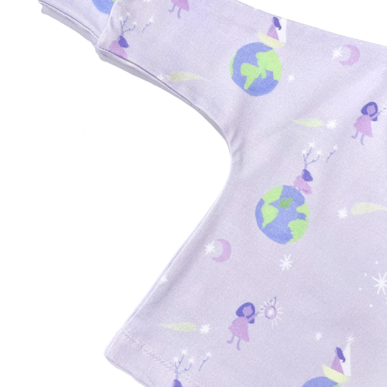 Close-up of the lavender star balloon fabric pattern showing the hidden Tall Trees signature leaf and premium knit texture.